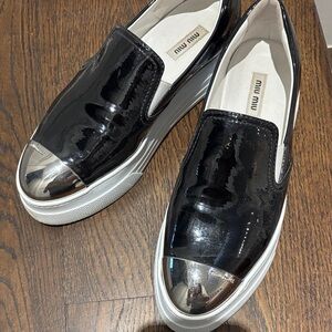 Miu Miu Glossy Black Sneakers with Metallic Silver Toe